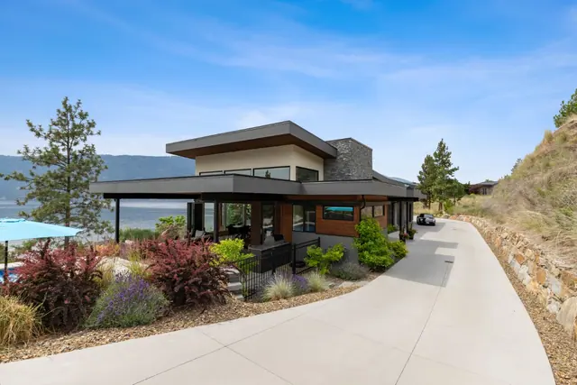 Exterior, luxury lake-view home in Lakestone, Lake Country, BC. Real estate photography by Pixel Pro Productions.