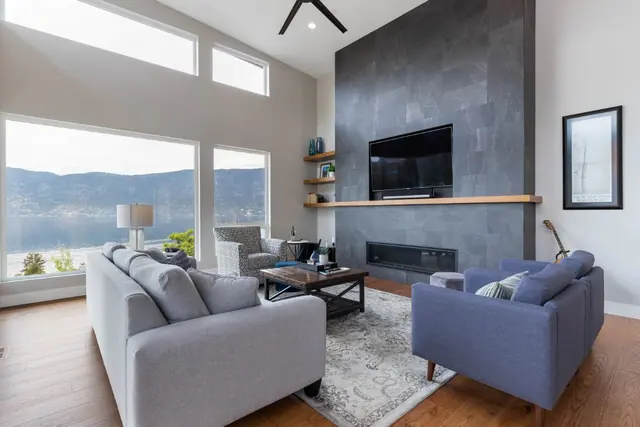 Living room lake view, luxury lake-view home in Lakestone, Lake Country, BC. Real estate photography by Pixel Pro Productions.