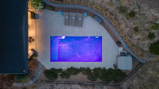Pool from above, luxury lake-view home in Lakestone, Lake Country, BC. Real estate photography by Pixel Pro Productions.
