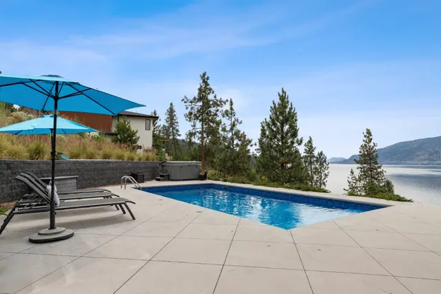 Pool lake view, luxury lake-view home in Lakestone, Lake Country, BC. Real estate photography by Pixel Pro Productions.