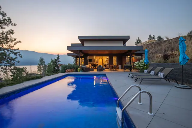 Pool twilight, luxury lake-view home in Lakestone, Lake Country, BC. Real estate photography by Pixel Pro Productions.