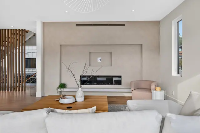 Living room fireplace, modern new build in McKinley Beach, Kelowna, BC. Real estate photography by Pixel Pro Productions.