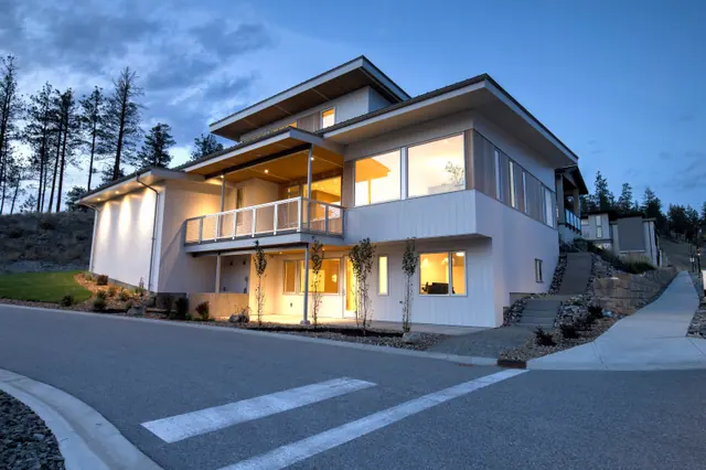 Twilight exterior, modern new build in McKinley Beach, Kelowna, BC. Real estate photography by Pixel Pro Productions.