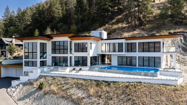 Aerial view exterior, luxury hillside estate in Vernon, BC. Real estate photography by Pixel Pro Productions.
