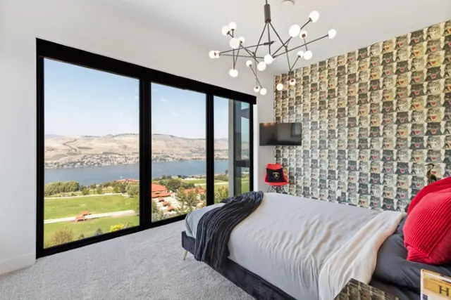 Bedroom lake view, luxury hillside estate in Vernon, BC. Real estate photography by Pixel Pro Productions.