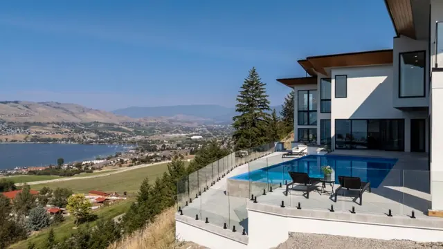 Pool lake view, luxury hillside estate in Vernon, BC. Real estate photography by Pixel Pro Productions.