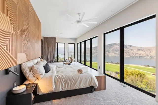 Primary bedroom view, luxury hillside estate in Vernon, BC. Real estate photography by Pixel Pro Productions.
