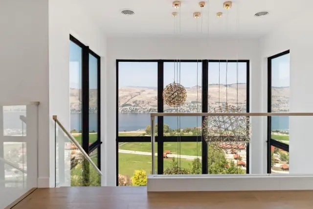 Staircase landing view, luxury hillside estate in Vernon, BC. Real estate photography by Pixel Pro Productions.