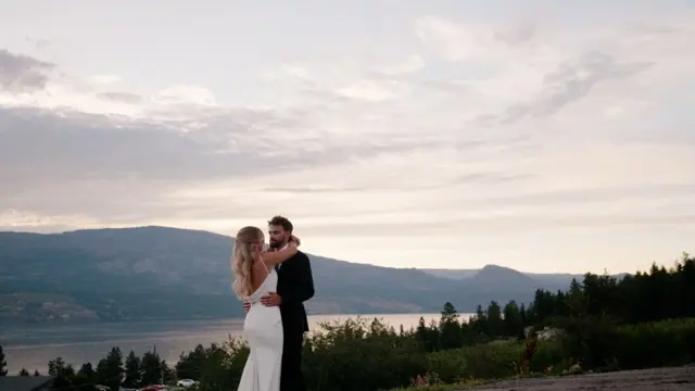 Lake view embrace: Emily & Connor's wedding at 50th Parallel Estate, Lake Country. Still from the Pixel Pro wedding film.