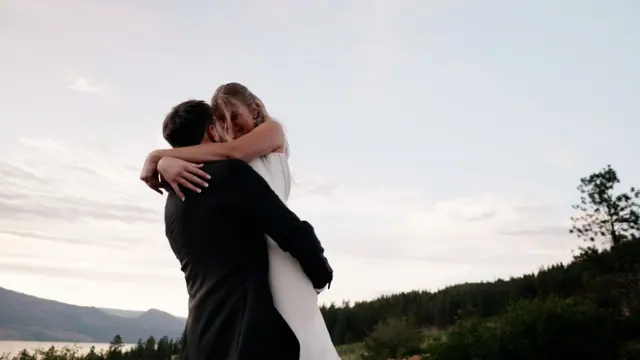 Lake view hug: Emily & Connor's wedding at 50th Parallel Estate, Lake Country. Still from the Pixel Pro wedding film.