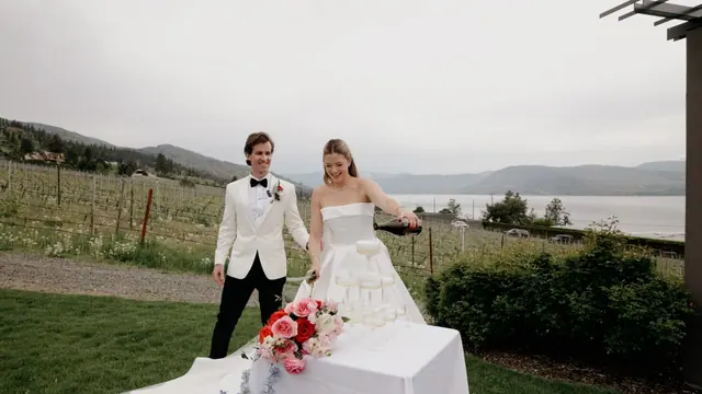 Vineyard toast: Catherine & Matt's wedding at CedarCreek Estate Winery, Kelowna. Still from the Pixel Pro wedding film.