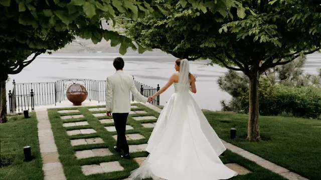 Garden walk to the lake: Catherine & Matt's wedding at Chateau Okanagan, Kelowna. Still from the Pixel Pro wedding film.