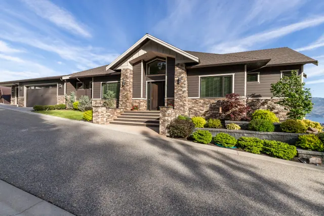 Front exterior, lake-view family home in West Kelowna, BC. Real estate photography by Pixel Pro Productions.