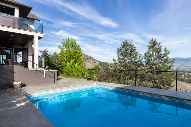 Pool lake view, lake-view family home in West Kelowna, BC. Real estate photography by Pixel Pro Productions.