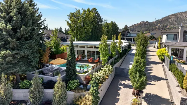 Aerial view front, mid-century modern home in West Kelowna, BC. Real estate photography by Pixel Pro Productions.