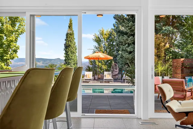 Dining pool view, mid-century modern home in West Kelowna, BC. Real estate photography by Pixel Pro Productions.