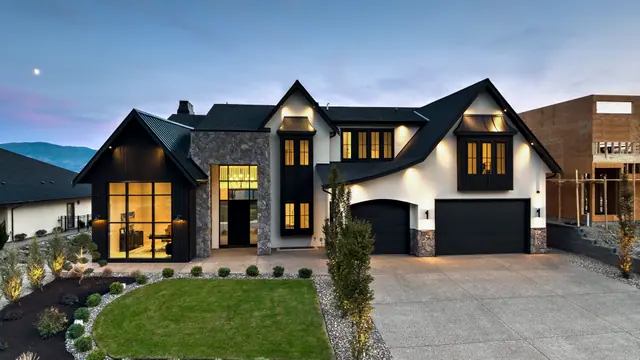 Exterior dusk, modern farmhouse new build in West Kelowna, BC. Real estate photography by Pixel Pro Productions.