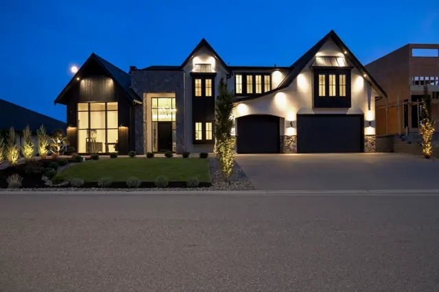 Twilight exterior, modern farmhouse new build in West Kelowna, BC. Real estate photography by Pixel Pro Productions.