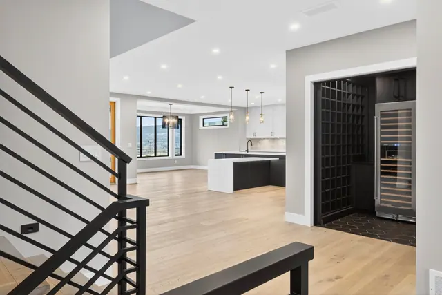 Wine room, new-build lake-view home in West Kelowna, BC. Real estate photography by Pixel Pro Productions.